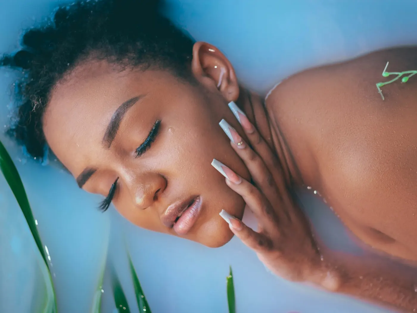 Client relaxing during a traditional cleansing bath ritual